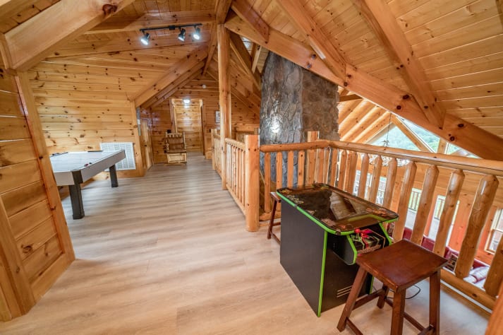 Arcade games and air hockey at the top floor common area Pigeon Forge, Tennessee Cabin Rental - Gallery Image #31