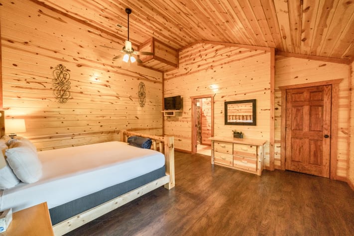 Bedroom 4: king bed, Tv and full bathroom Pigeon Forge, Tennessee Cabin Rental - Gallery Image #28