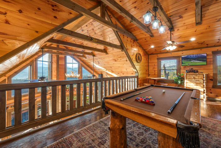 The open loft is a great hang out for kids and adults. Pool table, smart TV, and… Sevierville, Tennessee Cabin Rental - Gallery Image #30