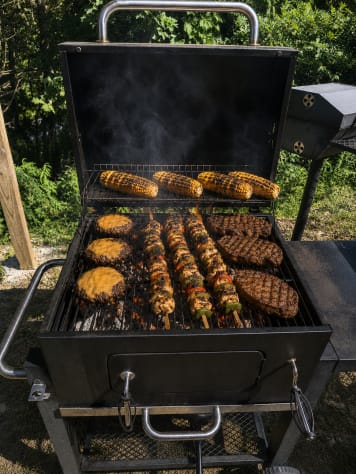 Covered-porch BBQ ready for cookouts — grill for all 10 guests without leaving the… Douglas Lake, Tennessee Cabin Rental - Gallery Image #12