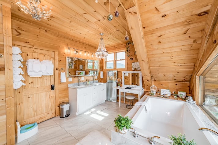 Primary bedroom bathroom with large shower and bathtub. Pigeon Forge, Tennessee Cabin Rental - Gallery Image #24