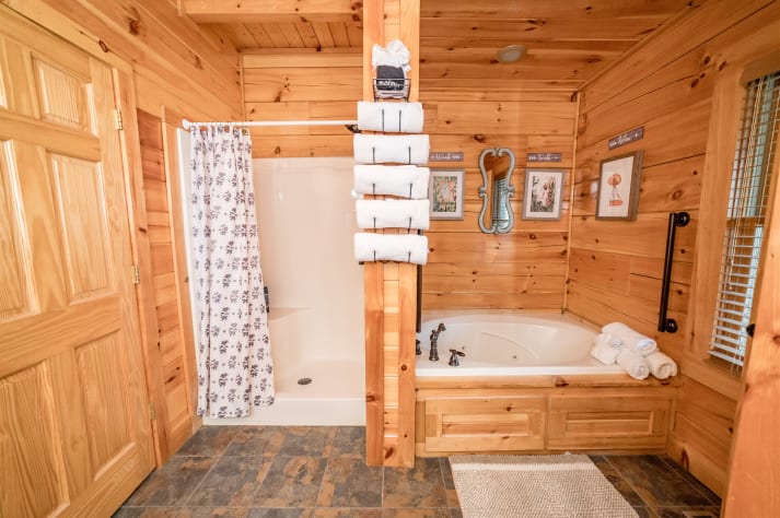 Shower and bathtub of bathroom 1 Pigeon Forge, Tennessee Cabin Rental - Gallery Image #28