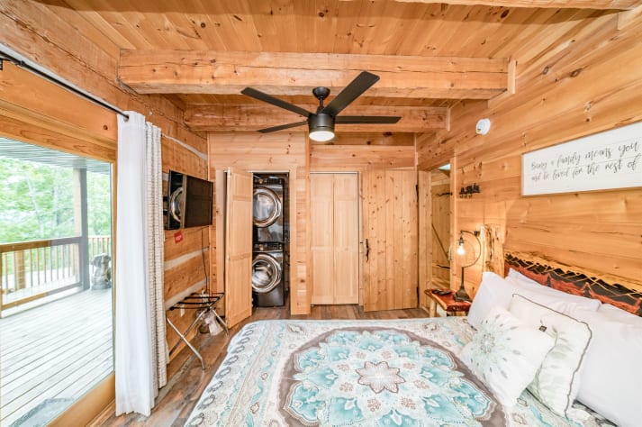 Queen bed located on the main floor. Pigeon Forge, Tennessee Cabin Rental - Gallery Image #35