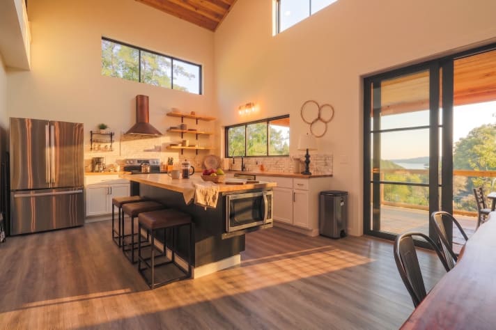 Kitchen opens straight to the deck and the water view — pass-through entertaining… Douglas Lake, Tennessee Cabin Rental - Gallery Image #17