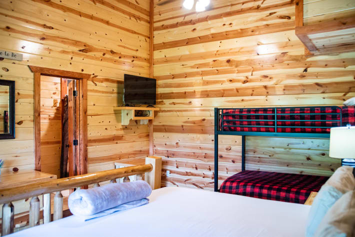 Bedroom 5: king bed, twin bunks, Tv and full bathroom Pigeon Forge, Tennessee Cabin Rental - Gallery Image #36