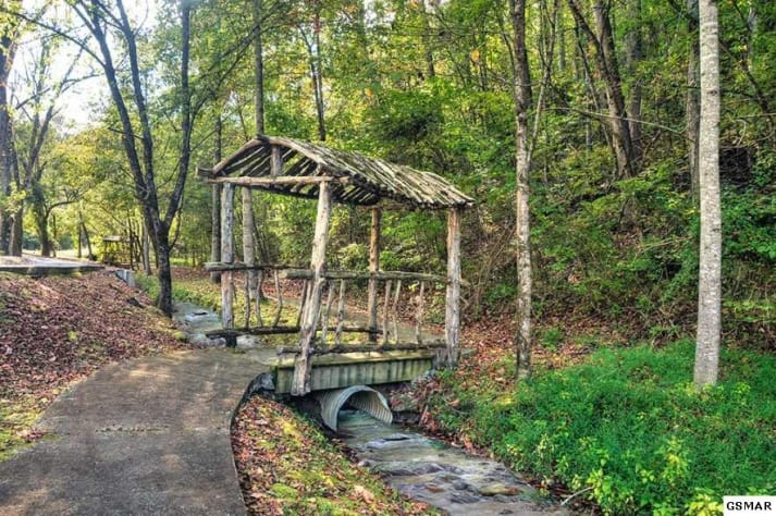 Stream and bridge in Alpine Mountain Village. Pigeon Forge, Tennessee Cabin Rental - Gallery Image #3