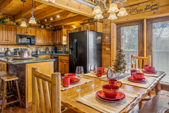 Log Dining Table with additional setting at the bar. Pigeon Forge, Tennessee Cabin Rental - Gallery Image #2