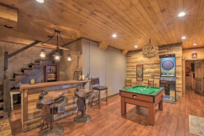 Bar with saddle barstools and game room complete with bumper pool, foosball and… Nantahala Lake, North Carolina Cabin Rental - Gallery Image #12