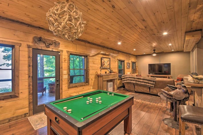 Bar with saddle barstools and game room complete with bumper pool, foosball and… Nantahala Lake, North Carolina Cabin Rental - Gallery Image #13