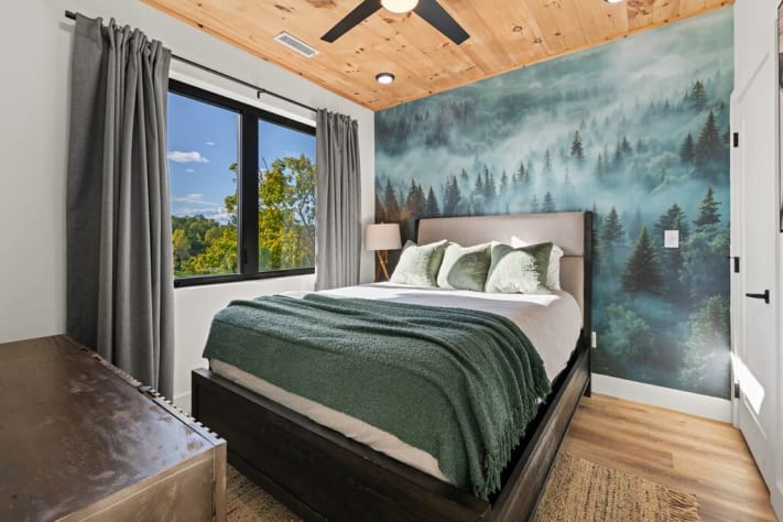 This upper level bedroom has a comfortable queen bed, smart tv, and STUNNING views Sevierville, Tennessee Cabin Rental - Gallery Image #13