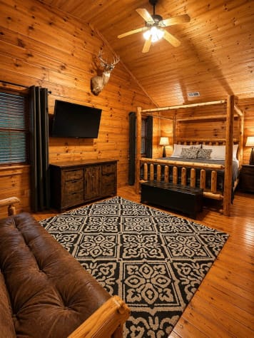 Large master bedroom with comfortable king bed plus a full sized futon bed and en… Gatlinburg, Tennessee Cabin Rental - Gallery Image #3