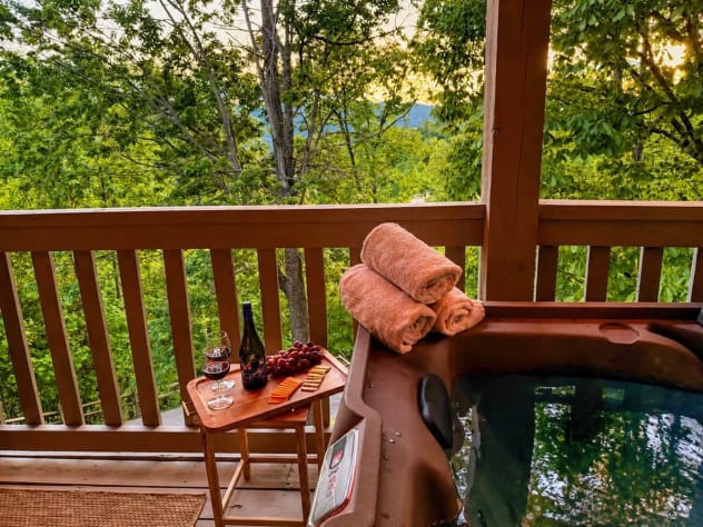 Enjoy a soak in the hot tub with some beautiful sunset views over the mountains! Gatlinburg, Tennessee Cabin Rental - Gallery Image #6