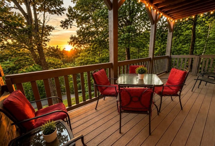 Lower deck for dining and admiring the beautiful sunset views! Gatlinburg, Tennessee Cabin Rental - Gallery Image #14