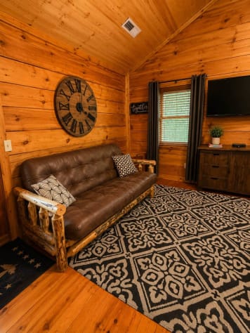 Master bedroom futon sofa Gatlinburg, Tennessee Cabin Rental - Gallery Image #19