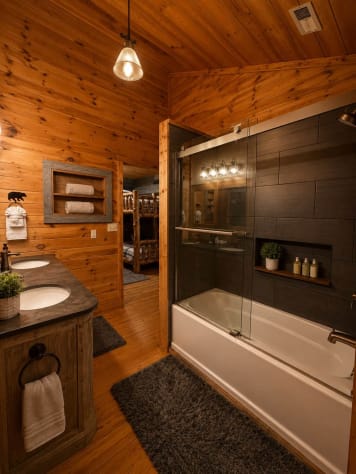 Full bath next to bunk room with tub and shower. Gatlinburg, Tennessee Cabin Rental - Gallery Image #23