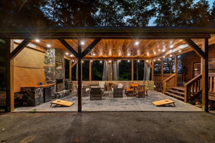 our amazing outdoor living room: fireplace, grill, TV, fridge & cool mtn breeze Pigeon Forge, Tennessee Cabin Rental - Gallery Image #1