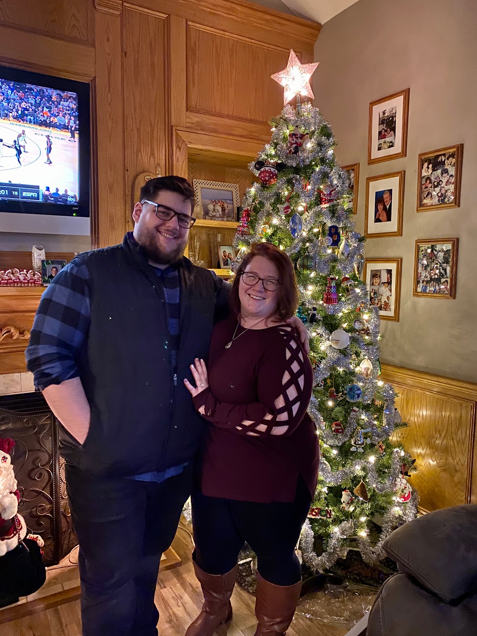 Meg and Ryan in front of a christmas tree