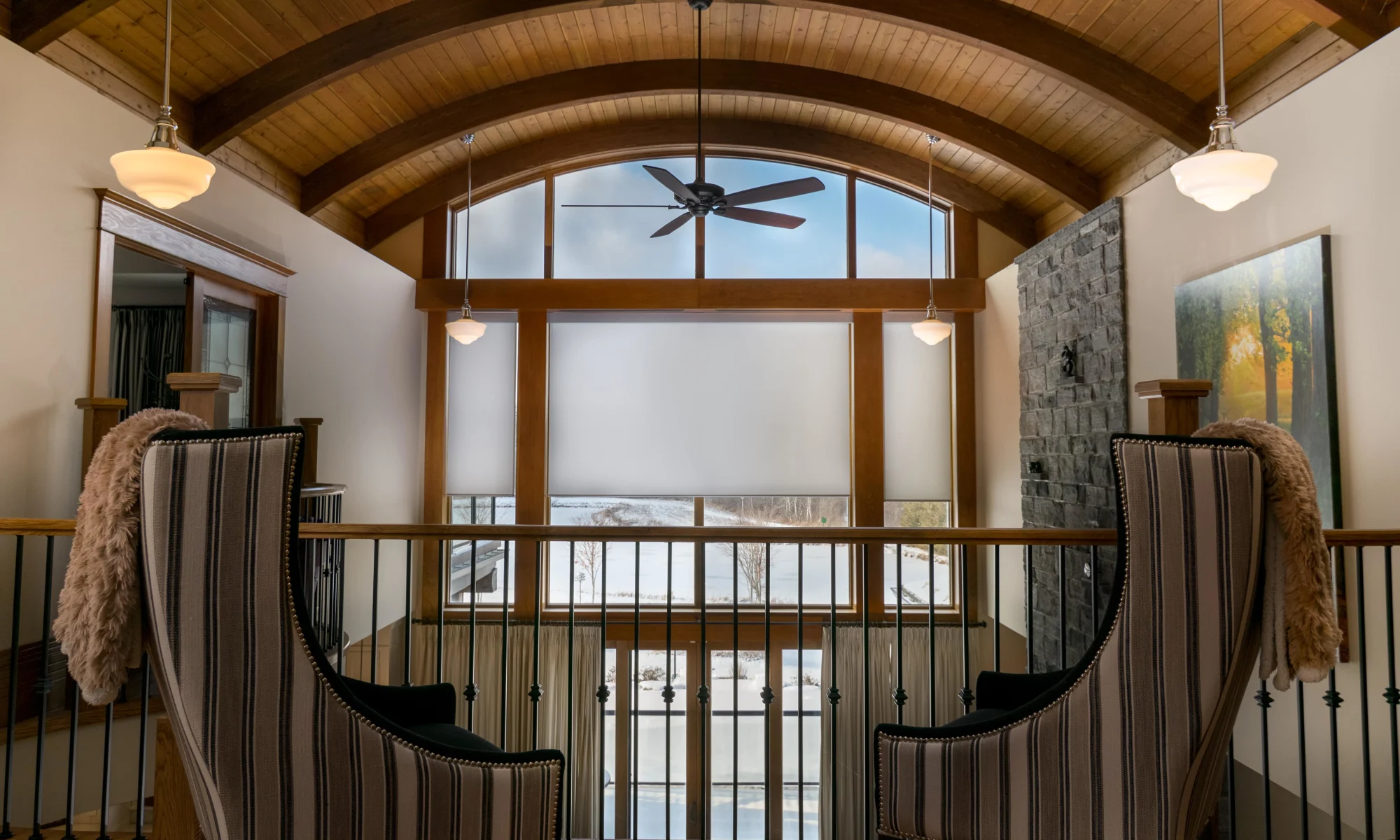 Hardwired, motorized blinds are controlled from anywhere in this smart home.