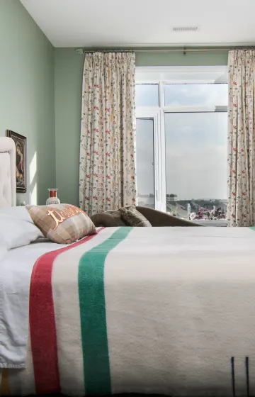 Bedroom with embroidered taffeta and blackout drapes