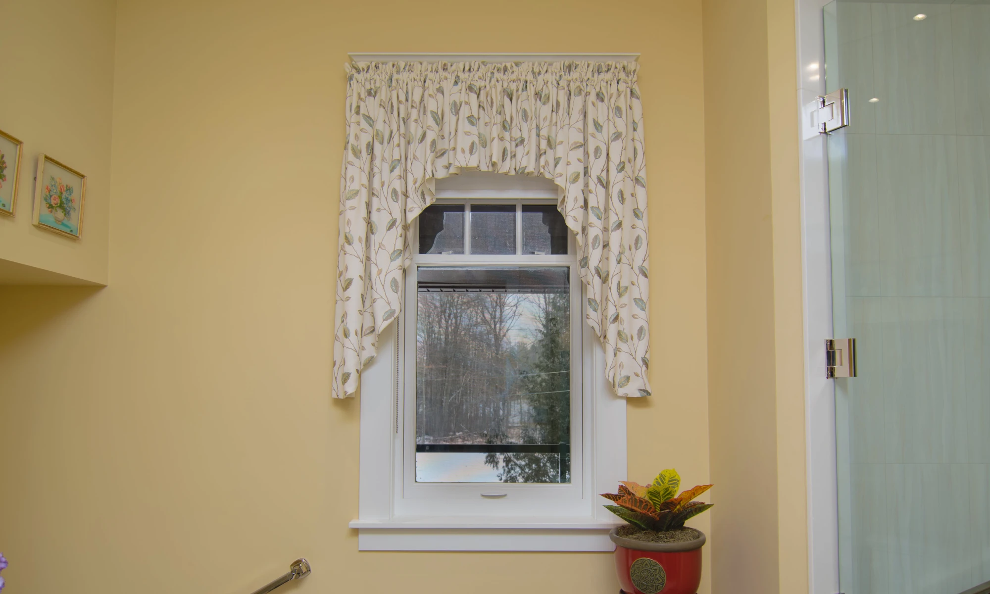 Elegant Bathroom with a gathered, shaped rod pocket valance in a nice fresh leaf pattern.
