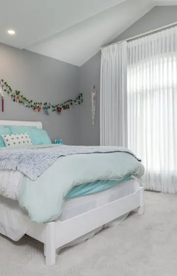 Girls room with sheers and linen drapes for blackout sleeping