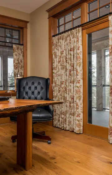 Gorgeous floral printed drapes add a lot of interest to this home office
