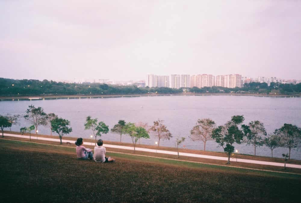 Couple talking at Bedok reservoir Singapore