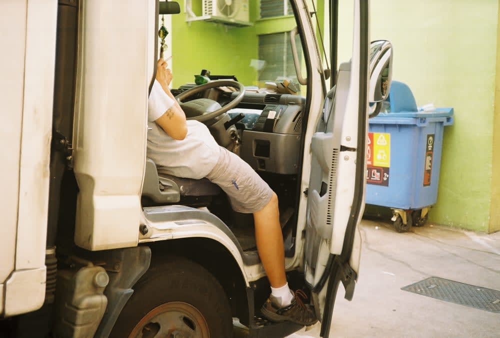 Driver resting between shifts in Singapore Bugis