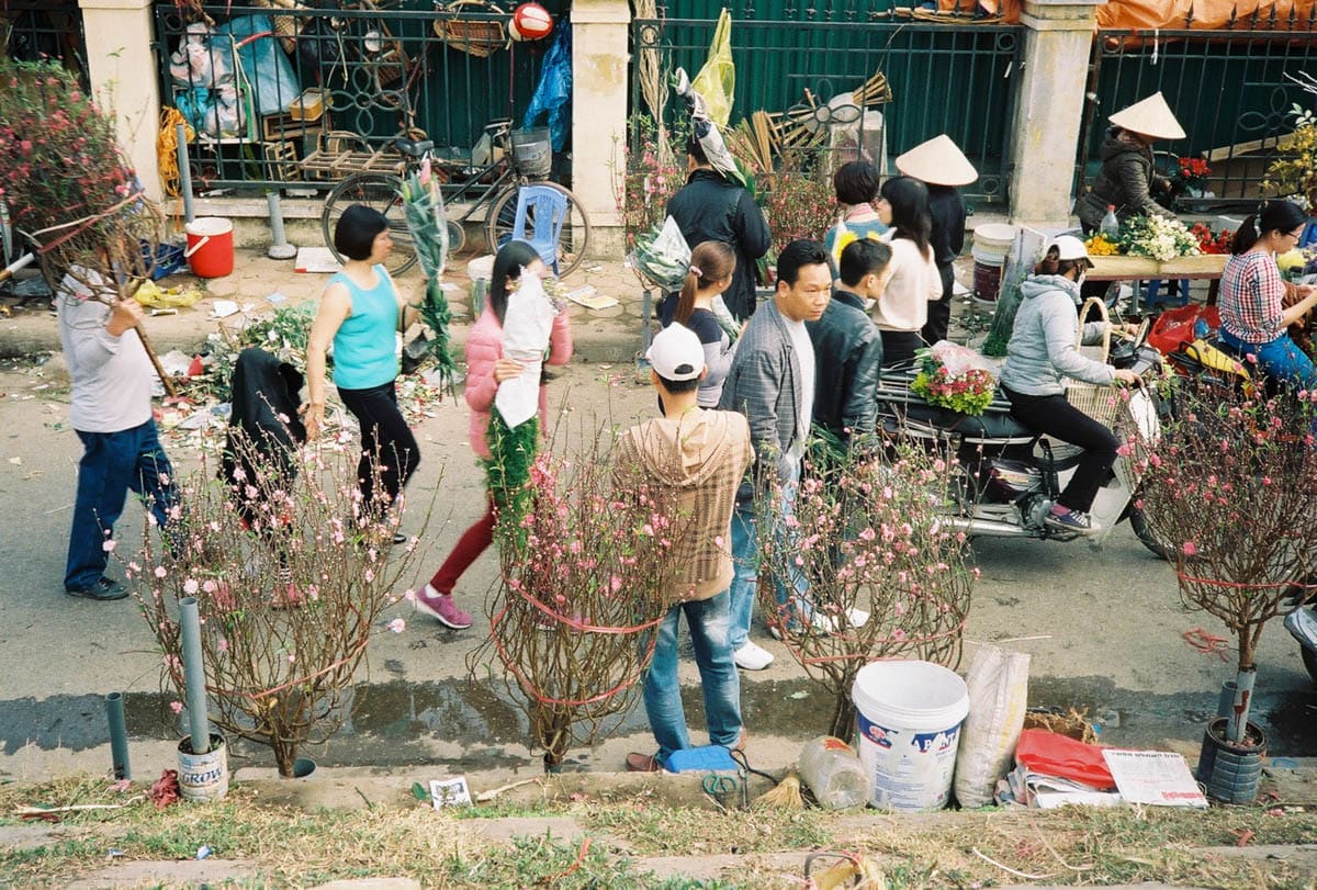 people walking at flower market Hanoi