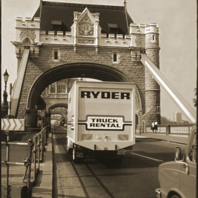 Back view of a Ryder Rental Truck driving