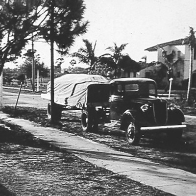 1940s Ryder Truck with covered trailer on the road