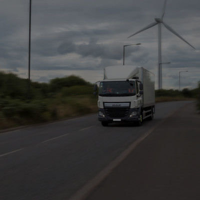 Ryder vehicle with wind turbine in background