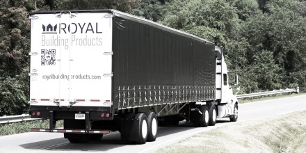 Truck with Royal branding driving on the road