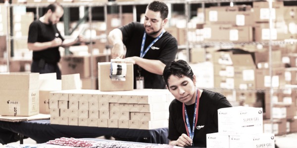 Warehouse workers packaging boxes