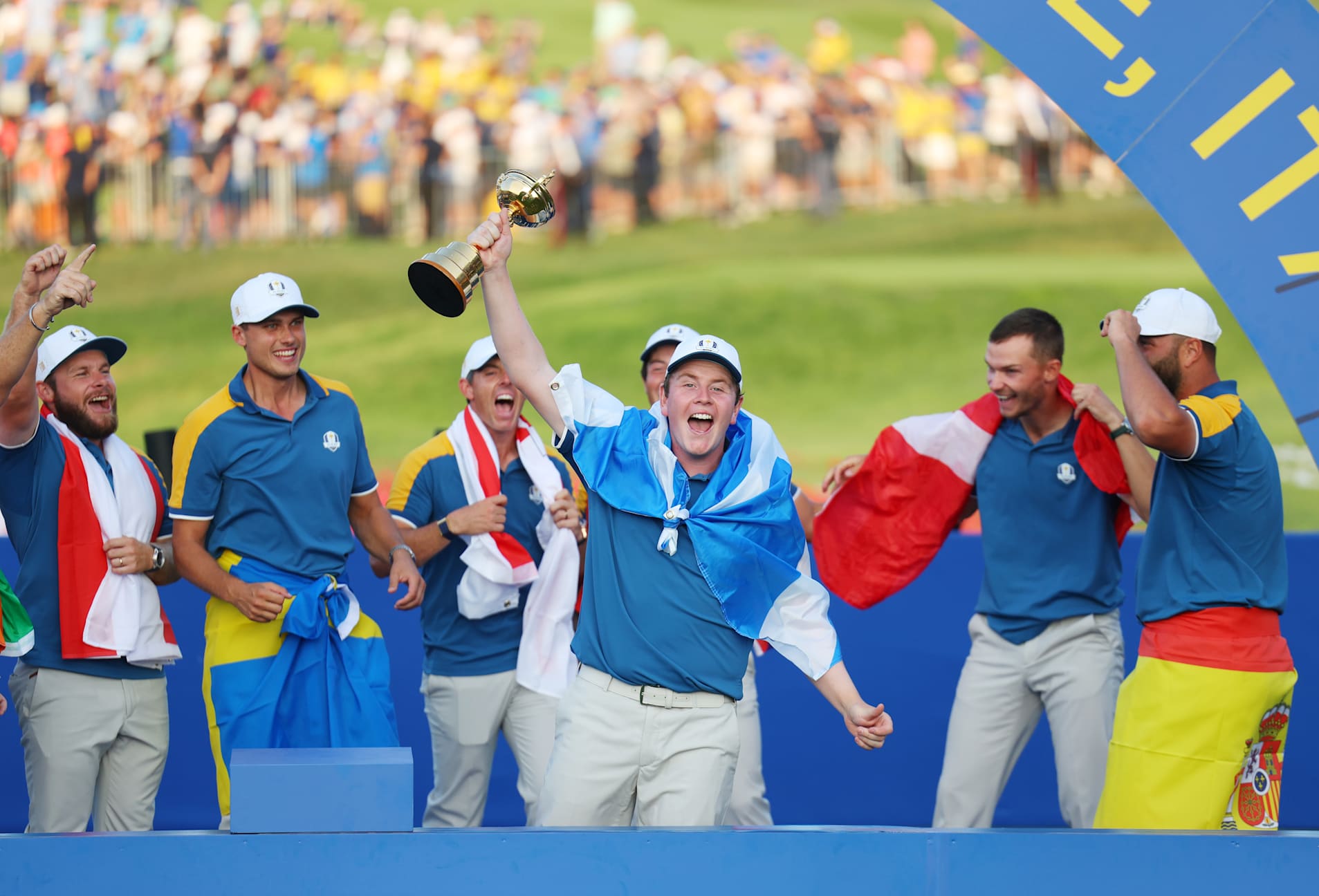 ROME, ITALY - OCTOBER 01: Robert MacIntyre of Team Europe  lifts the Ryder Cup trophy following victory with 16 and a half to 11 and a half win following the Sunday singles matches of the 2023 Ryder Cup at Marco Simone Golf Club on October 01, 2023 in Rome, Italy. (Photo by Andrew Redington/Getty Images)