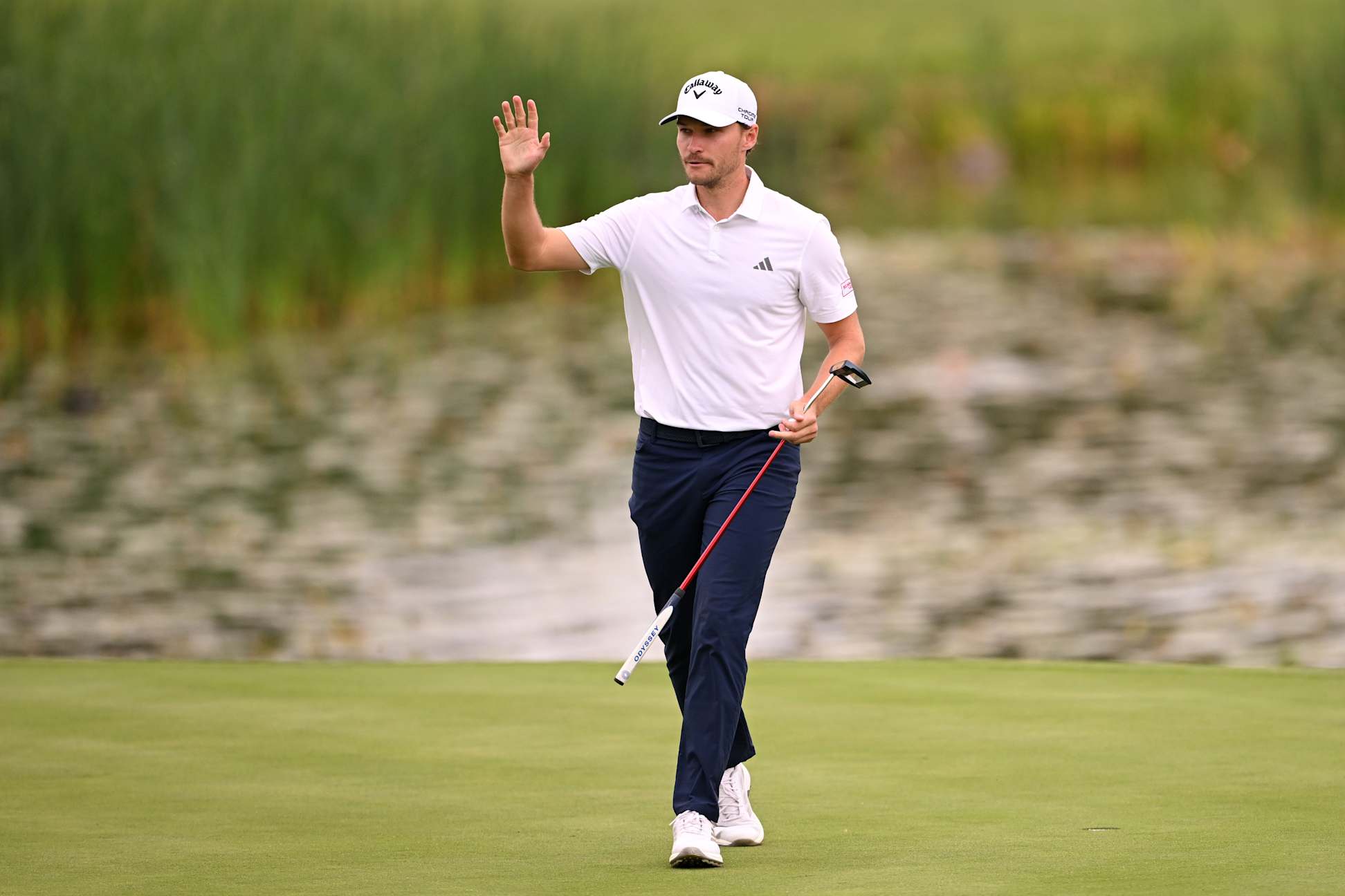 SUTTON COLDFIELD, ENGLAND - AUGUST 23: Rasmus Hojgaard of Denmark acknowledges the crowd on the 18th green on day three of the Betfred British Masters hosted by Sir Nick Faldo 2025 at The Belfry on August 23, 2025 in Sutton Coldfield, England. (Photo by Ross Kinnaird/Getty Images)