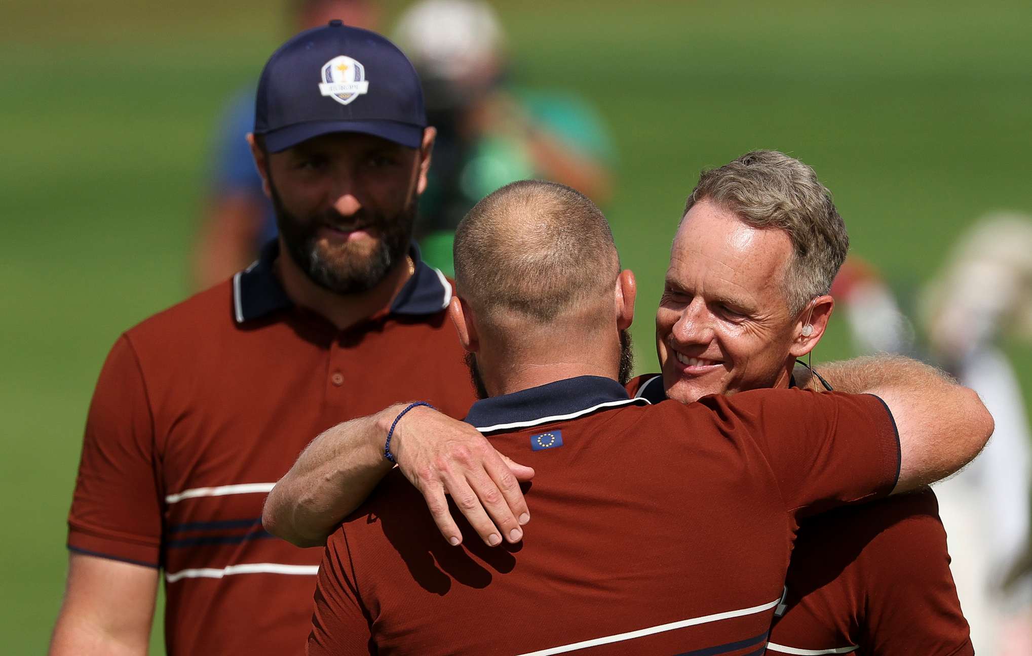 FARMINGDALE, NEW YORK - SEPTEMBER 27: Jon Rahm (L) and Tyrrell Hatton (C) of Team Europe celebrate with Captain Luke Donald (R) after defeating Xander Schauffele and Patrick Cantlay (not pictured) of Team United States 3&2 on the 16th hole during the Saturday morning foursomes matches of the 2025 Ryder Cup at Black Course at Bethpage State Park Golf Course on September 27, 2025 in Farmingdale, New York. (Photo by Jamie Squire/Getty Images)