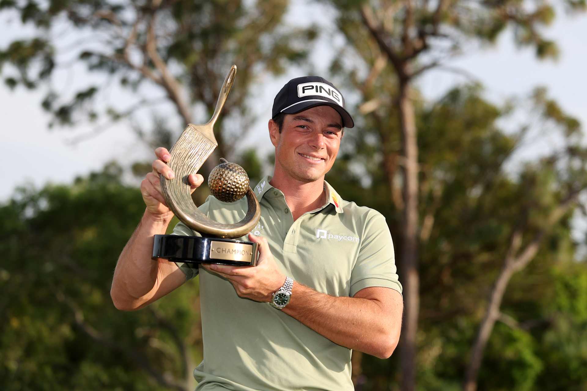 PALM HARBOR, FLORIDA - MARCH 23: Viktor Hovland of Norway poses with the trophy after putting in to win on the 18th green during the final round of the Valspar Championship 2025 at Innisbrook Resort and Golf Club on March 23, 2025 in Palm Harbor, Florida. (Photo by Brennan Asplen/Getty Images)