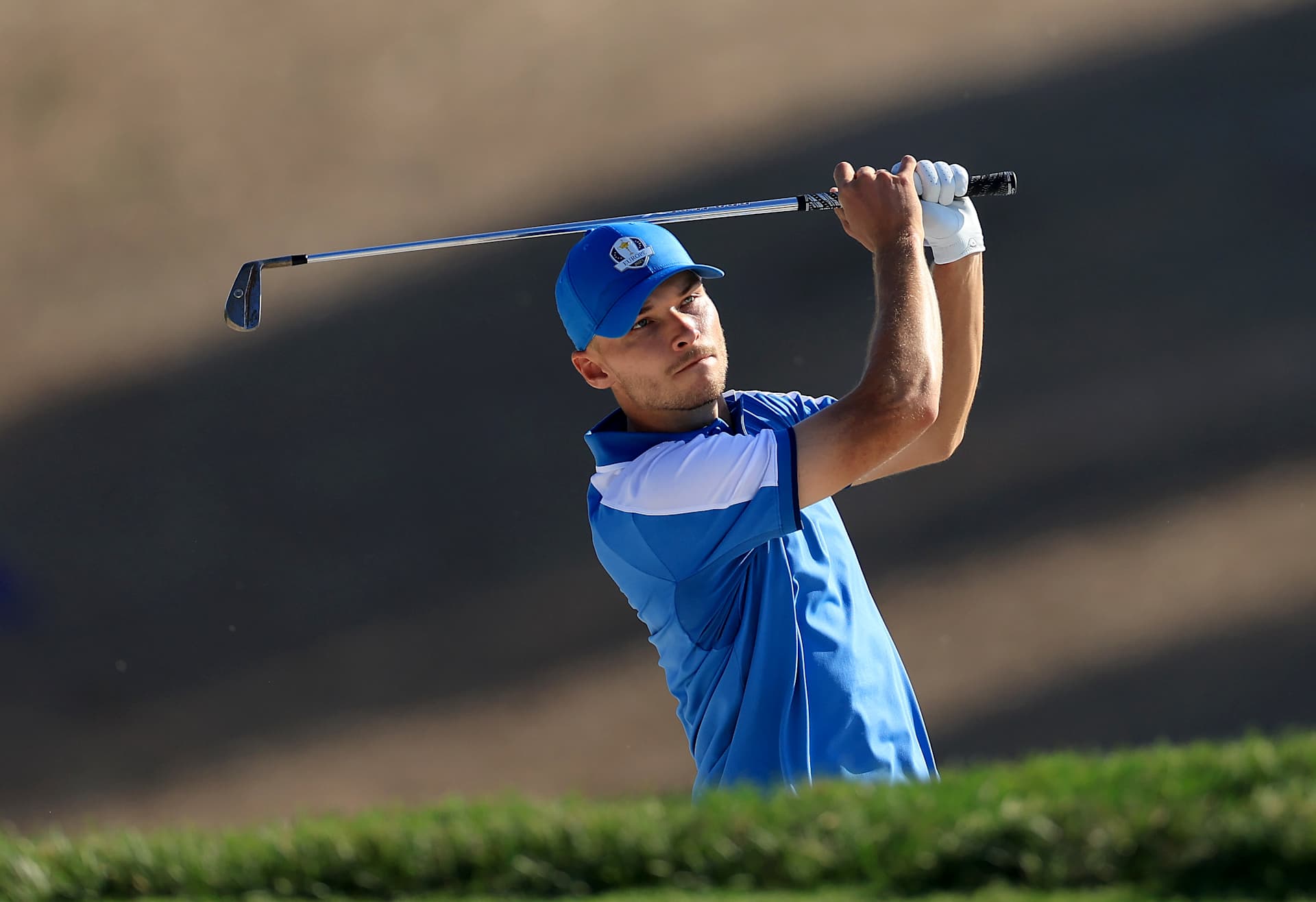 ROME, ITALY - SEPTEMBER 29: Nicolai Hpjgaard of Denmark and The European Team plays his second shot on the 12th hole in his match with Jon Rahm against Brooks Koepka and Scottie Scheffler of The United States Team during the Friday afternoon four-ball matches of the 2023 Ryder Cup at Marco Simone Golf Club on September 29, 2023 in Rome, Italy. (Photo by David Cannon/Getty Images)