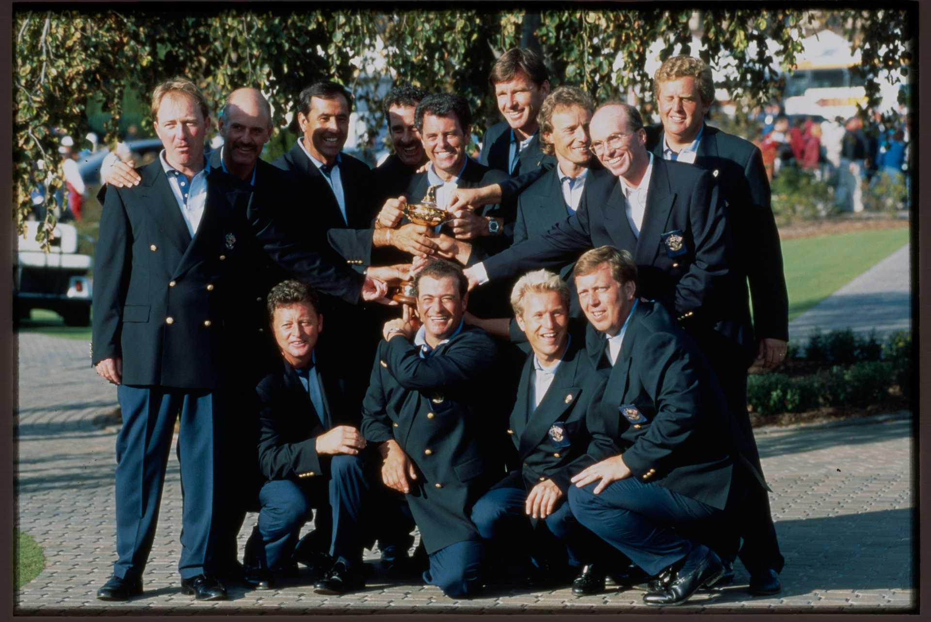 Team Europe members Philip Walton, Mark James, Ian Woosnam, Seve Ballesteros, Sam Torrance, Bernard Gallacher, Costantino Rocca, Nick Faldo, Bernhard Langer, Per-Ulrik Johansson, Howard Clark, David Gilford, and Colin Montgomerie during the 1995 Ryder Cup at Oak Hill Country Club in Pittsford, New York.
