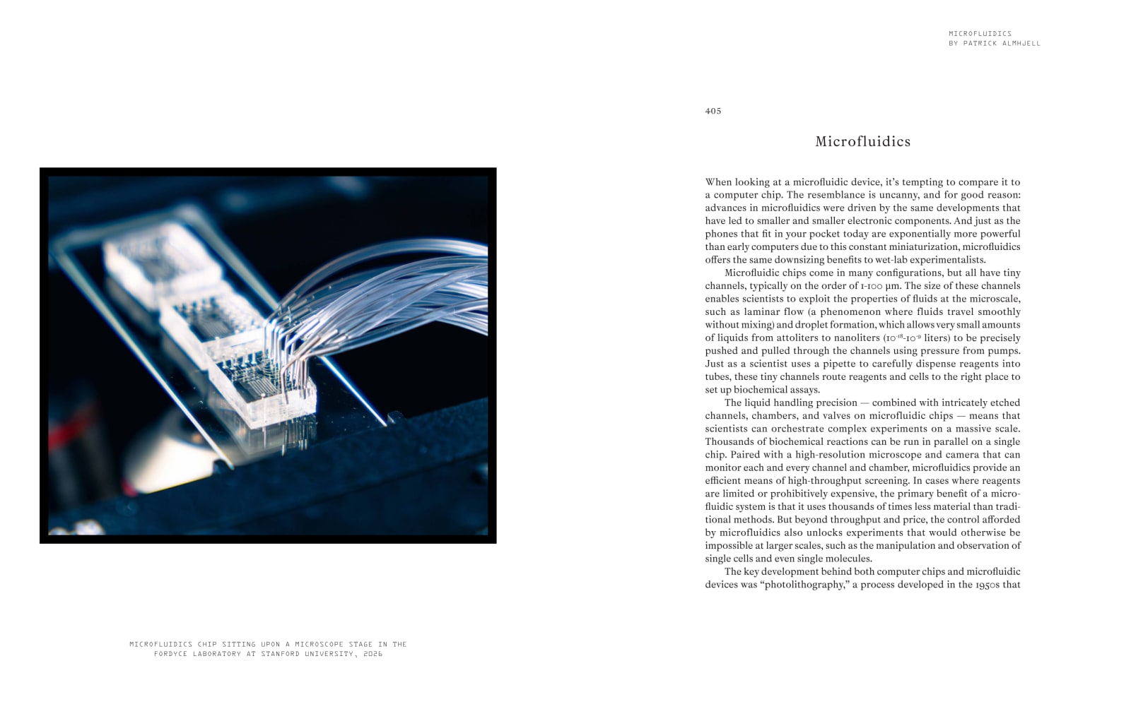 Pages 404–405 of Making the Modern Laboratory, showing a microfluidics chip connected to transparent tubing beside the opening of the Microfluidics essay.