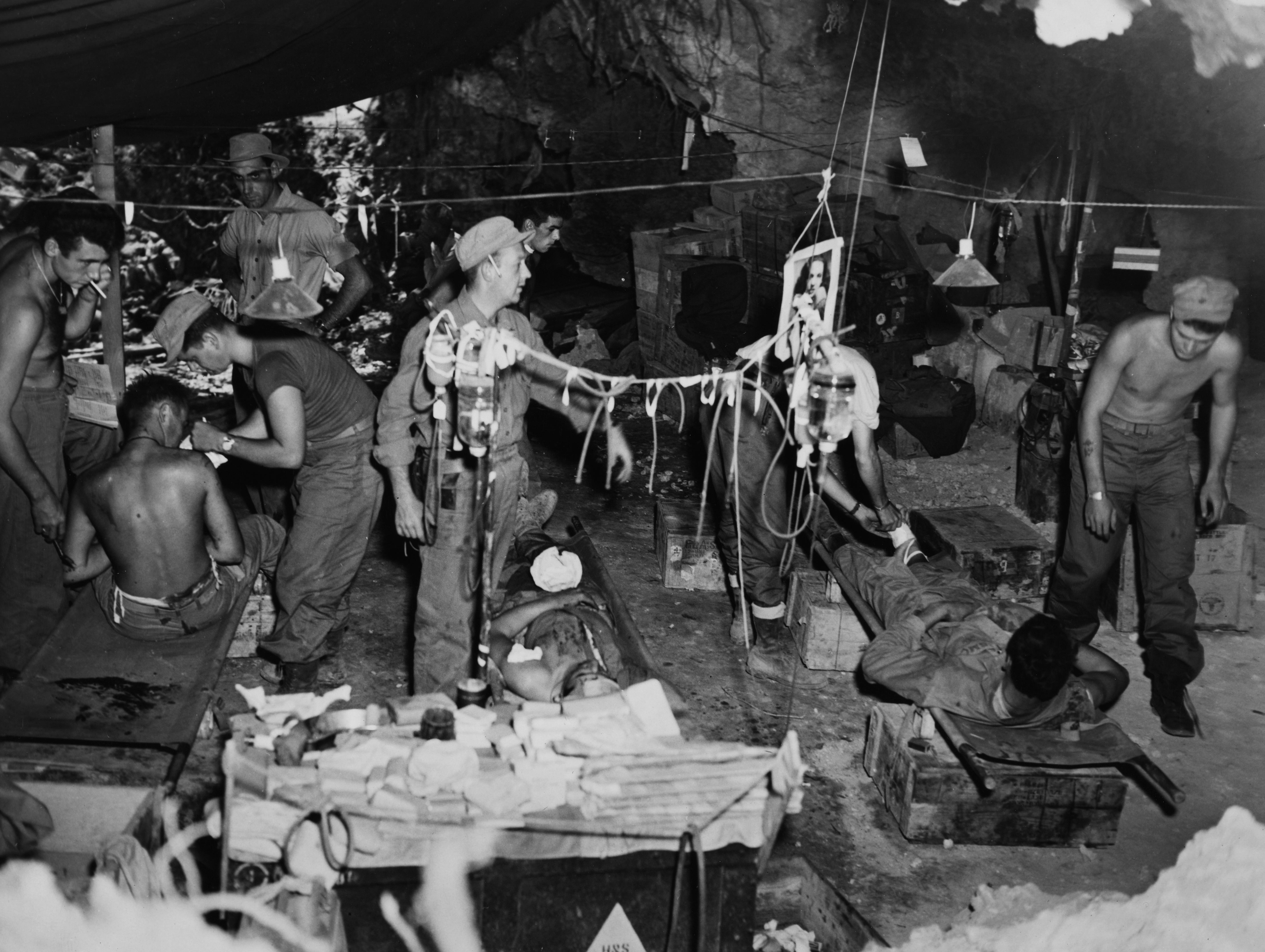 Wounded Marines in Okinawa are given blood and plasma during World War II.