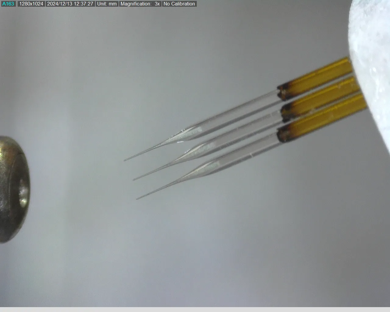 Multiple column emitters spraying liquid into a mass spectrometry machine.