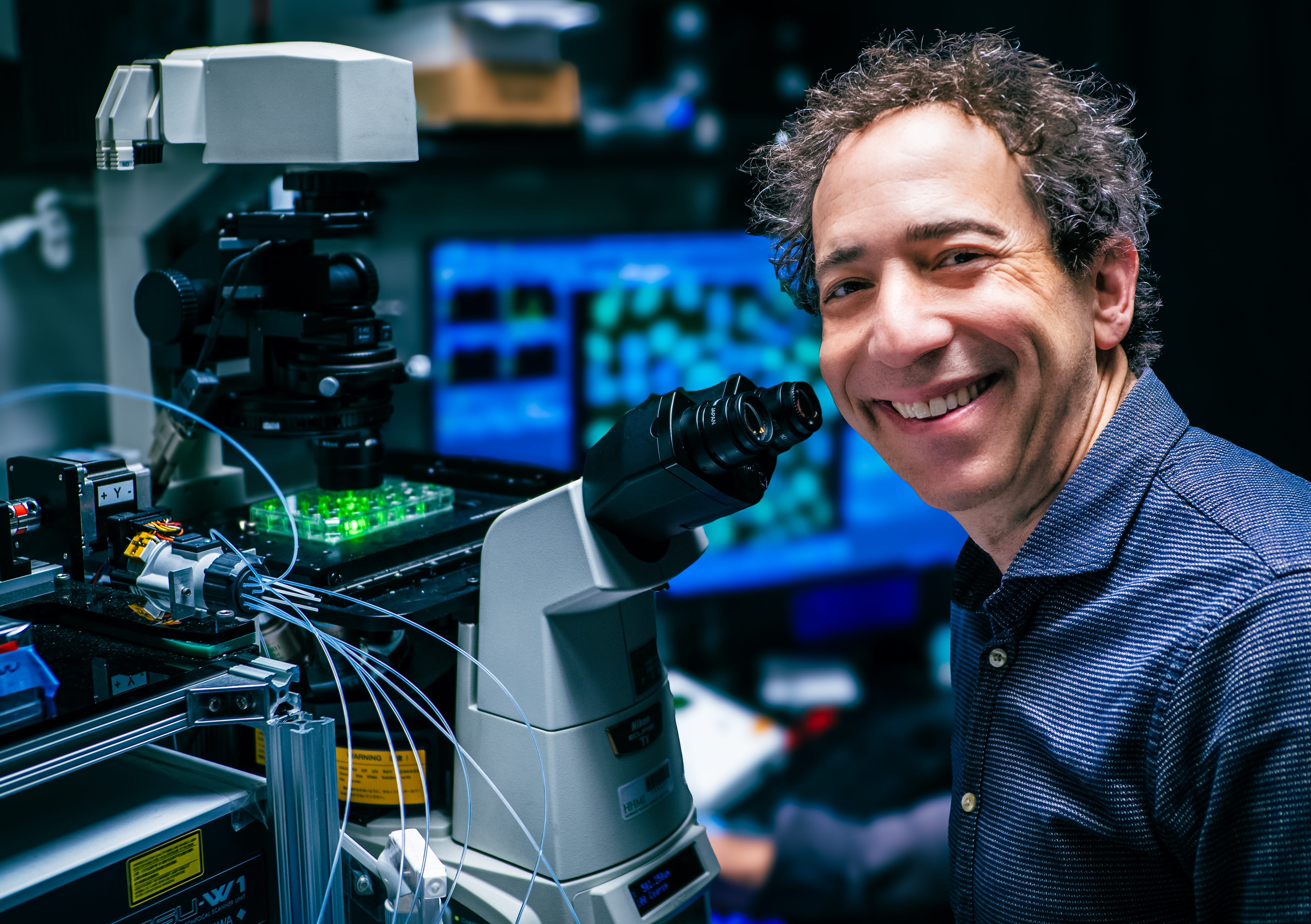 A recent photo of Michael Elowitz at the microscope.