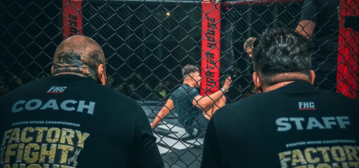 Coach and staff at the cage