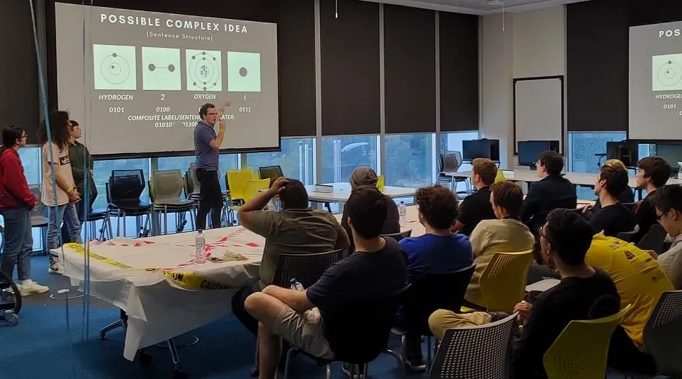 Wide shot of a team presenting