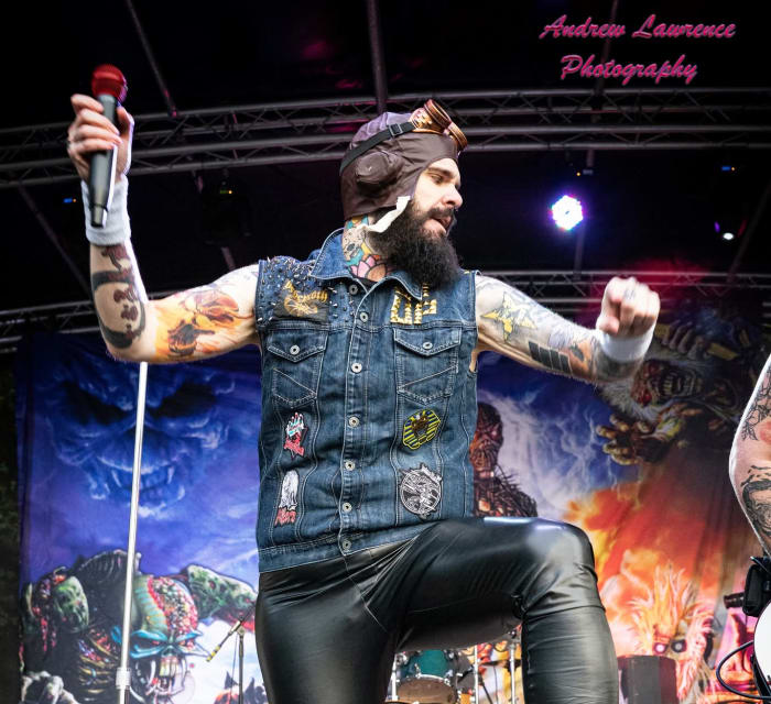 Ey Up Maiden live at Saltaire Festival 2026: Jon Crowder (vocals) in the Aces High aviator hat