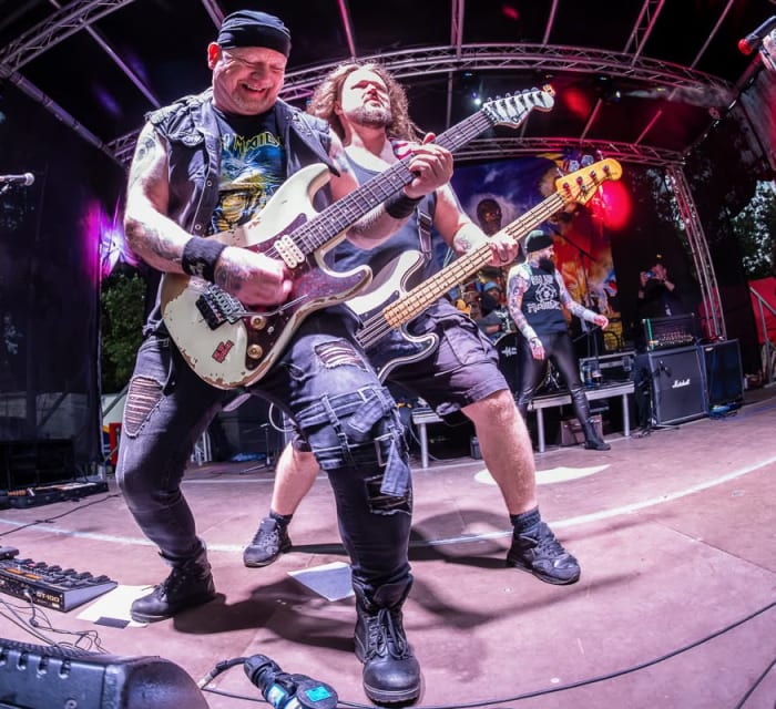 Ey Up Maiden live at Saltaire Festival 2026: Tony Rushworth (lead guitar) and Kurt 'Bomber' Evans (bass)