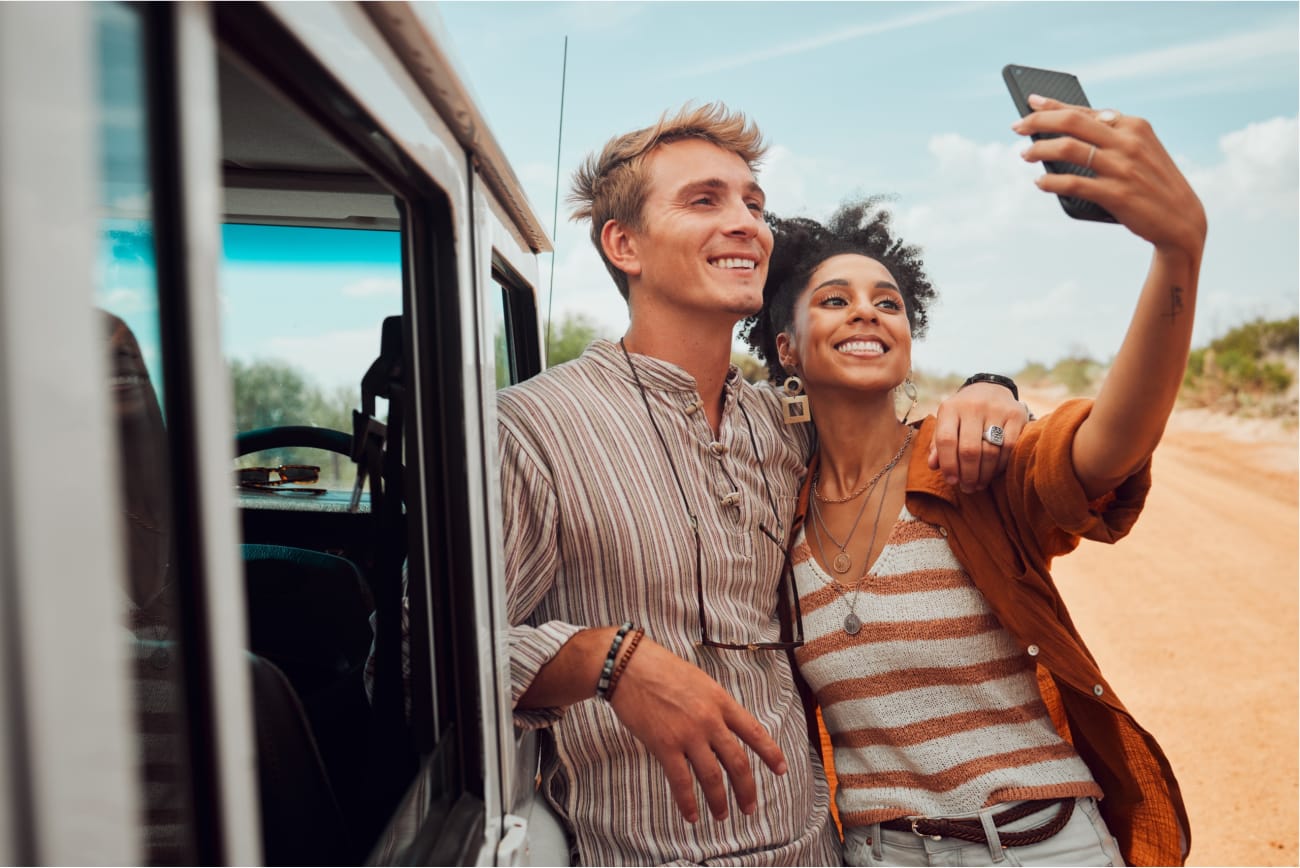 Couple on a self-drive safari stop for a picture