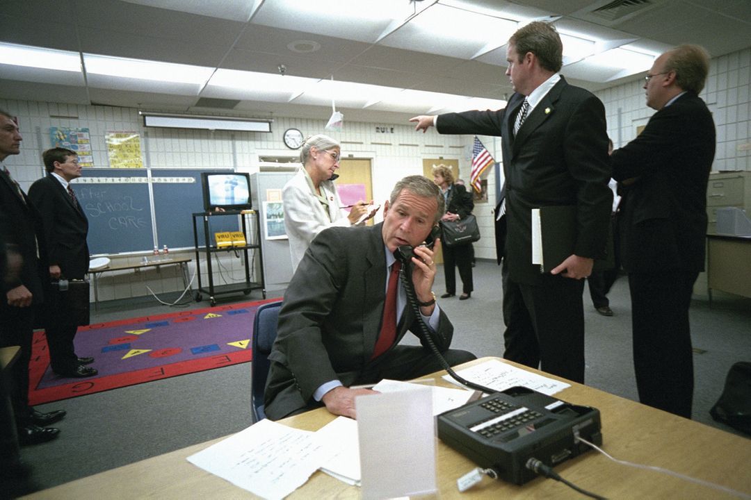 George W. Bush with White House aides and journalists in Emma E. Booker Elementary School's temporary media center.